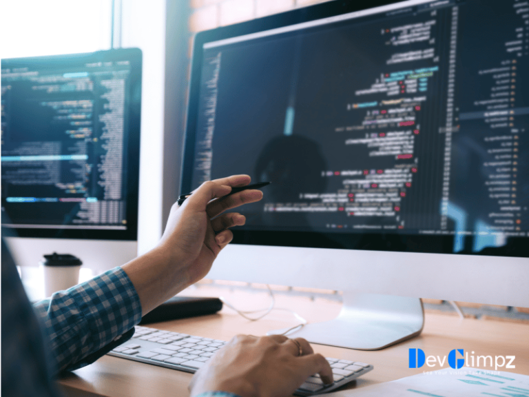 Developer working on code at two monitors displaying software scripts, illustrating DevGlimpz's comprehensive software development process including design, coding, testing, and deployment phases.